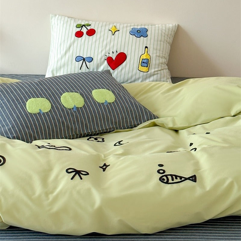Playful cotton duvet cover set with embroidered motifs and soft fitted sheet