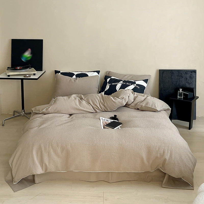 Textured cotton waffle duvet cover with pillowcases and fine contrasting piping