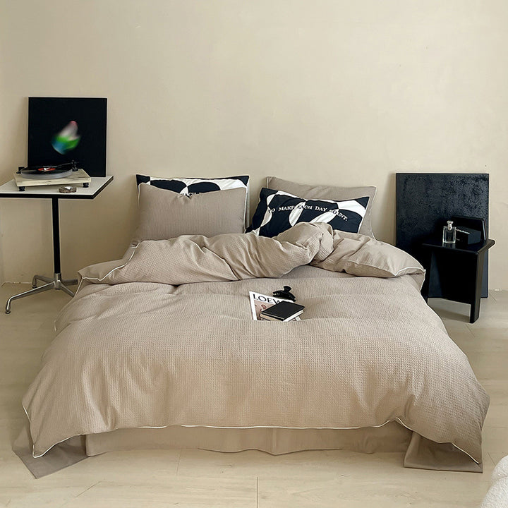 Textured cotton waffle duvet cover with pillowcases and fine contrasting piping