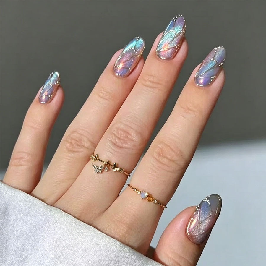 Artificial nail set with shimmering color gradients and elegant 3D details Stornfield