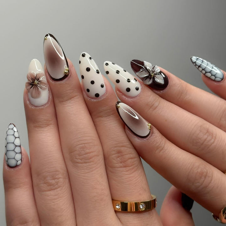 Designer artificial nails with floral and geometric accents Stornfield