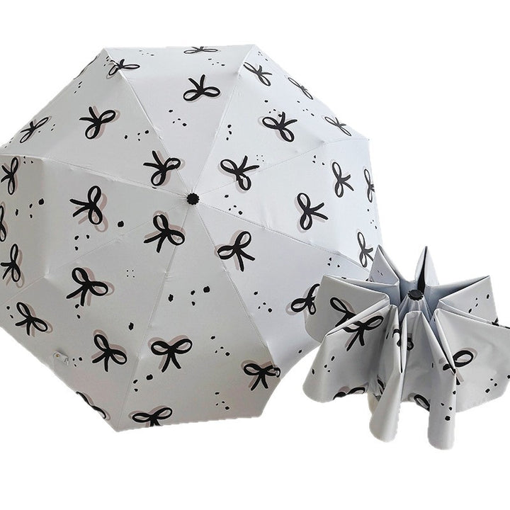 Women’s Folding Umbrella with Playful Bow Pattern Stornfield
