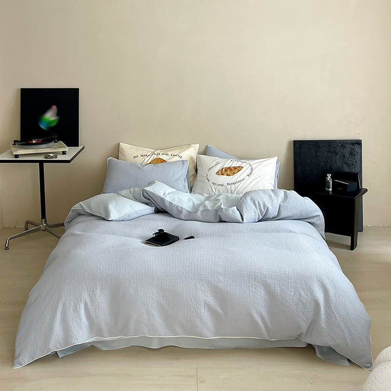 Textured cotton waffle duvet cover with pillowcases and fine contrasting piping