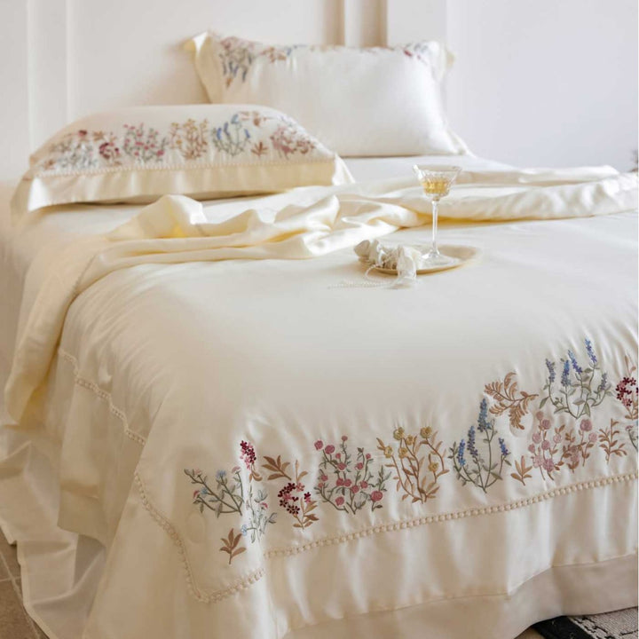 Exclusive satin bed linen set with fine floral embroidery and silky finish