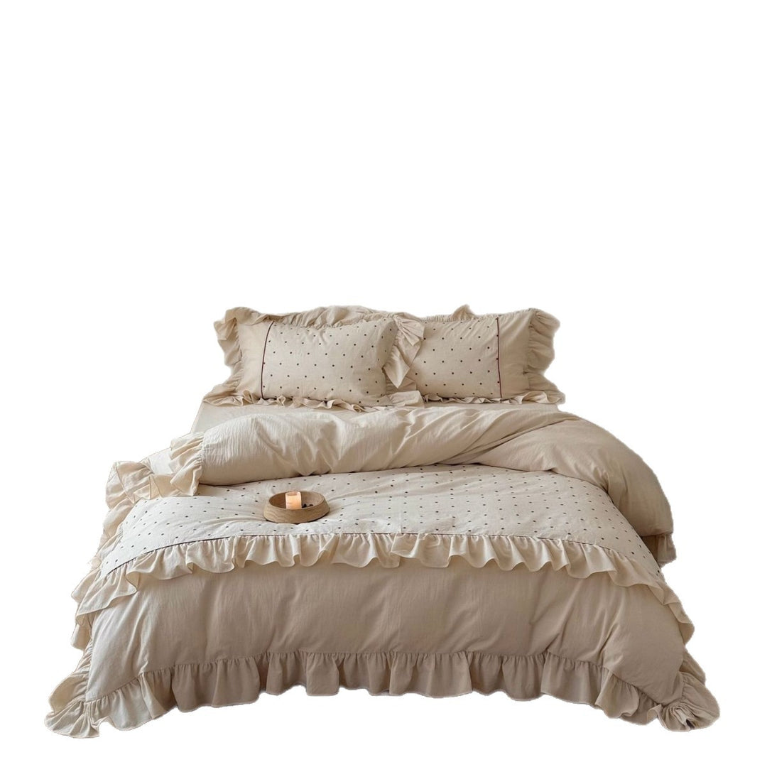 Romantic bedding set with ruffles and delicate dot embroidery
