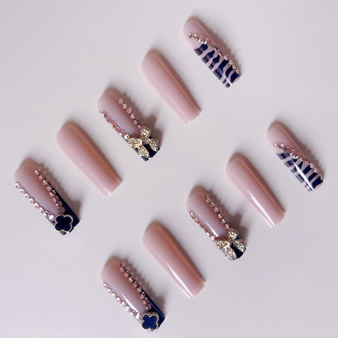 Glamorous artificial nails with elegant design with rhinestones and 3D decorations Stornfield