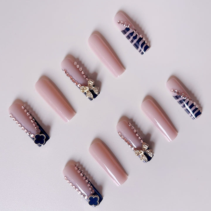 Glamorous artificial nails with elegant design with rhinestones and 3D decorations Stornfield