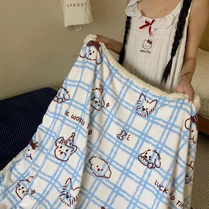 Reversible cuddle blanket with Sherpa fleece, cute dog illustrations and checkered pattern