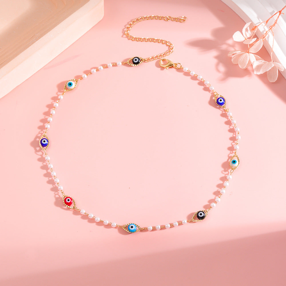 Elegant Pearl and Eye Charm Necklace Stornfield
