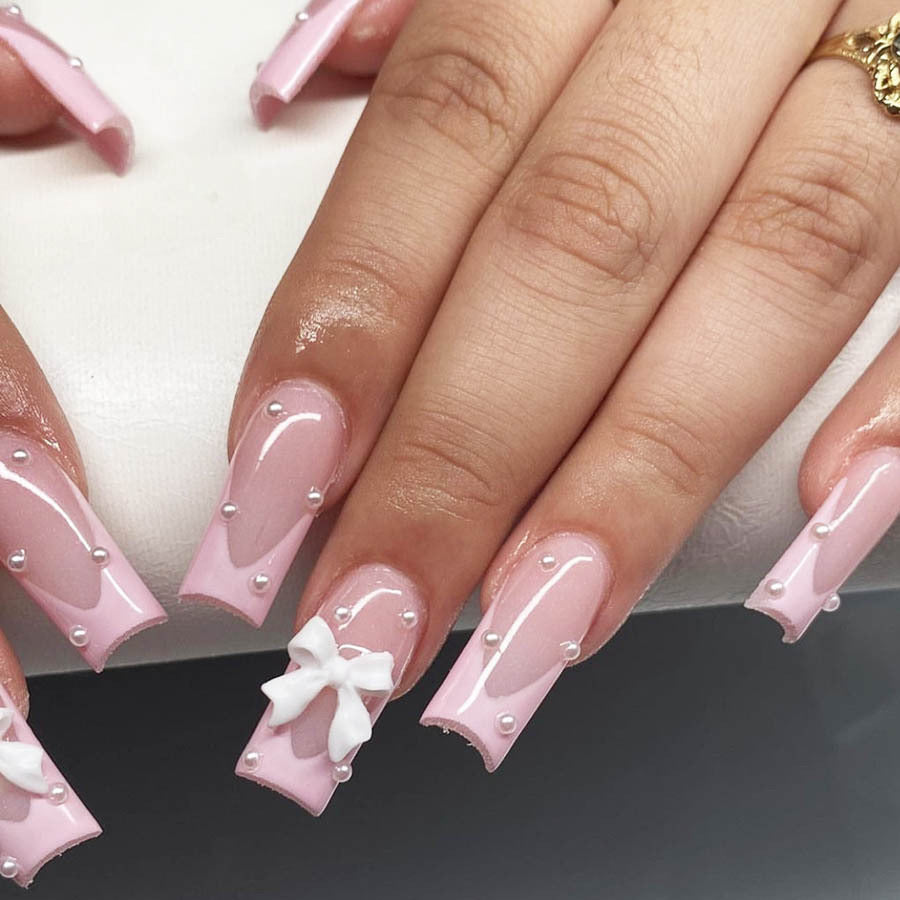 Artificial nail set with romantic bow and pearl embellishments Stornfield