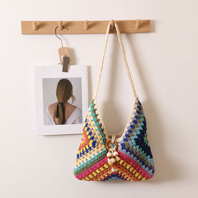 Handmade macrame shoulder bag with playful pendant Stornfield