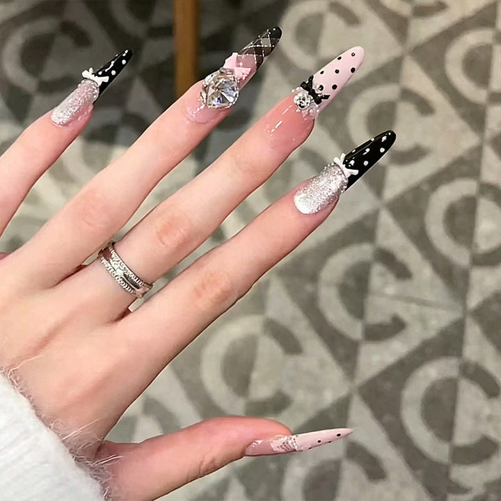 Artificial nail set with glamorous 3D applications and festive design Stornfield