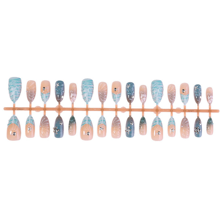 Artificial nail set with elegant shell pattern and 3D accents Stornfield