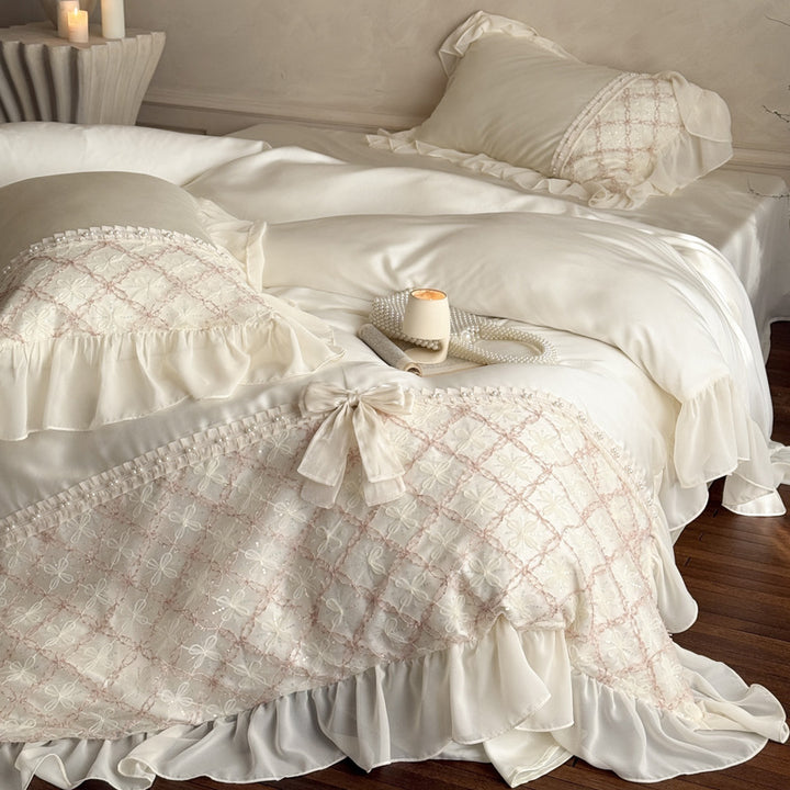 Romantic satin bedding set with ruffle, embroidered lace insert and bow appliqué