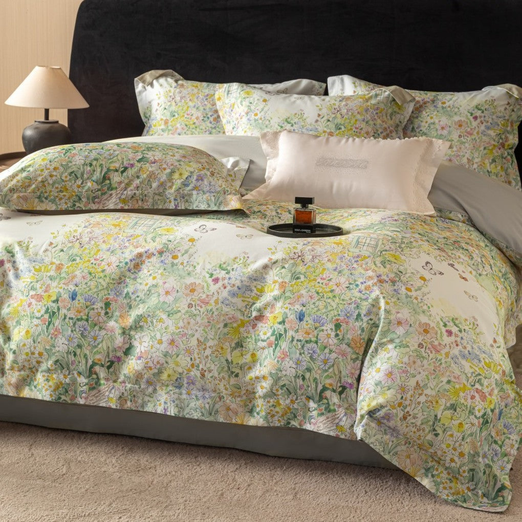 Cotton satin bedding set with watercolor flower print and reversible blanket