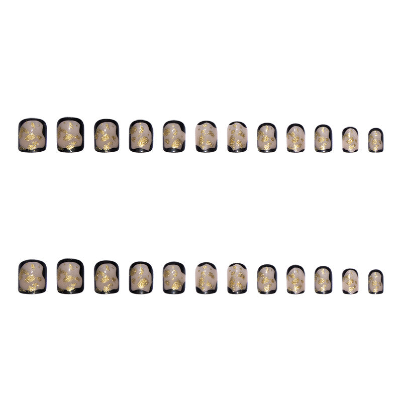 Artificial nail set with delicate gold accents and elegant finish Stornfield