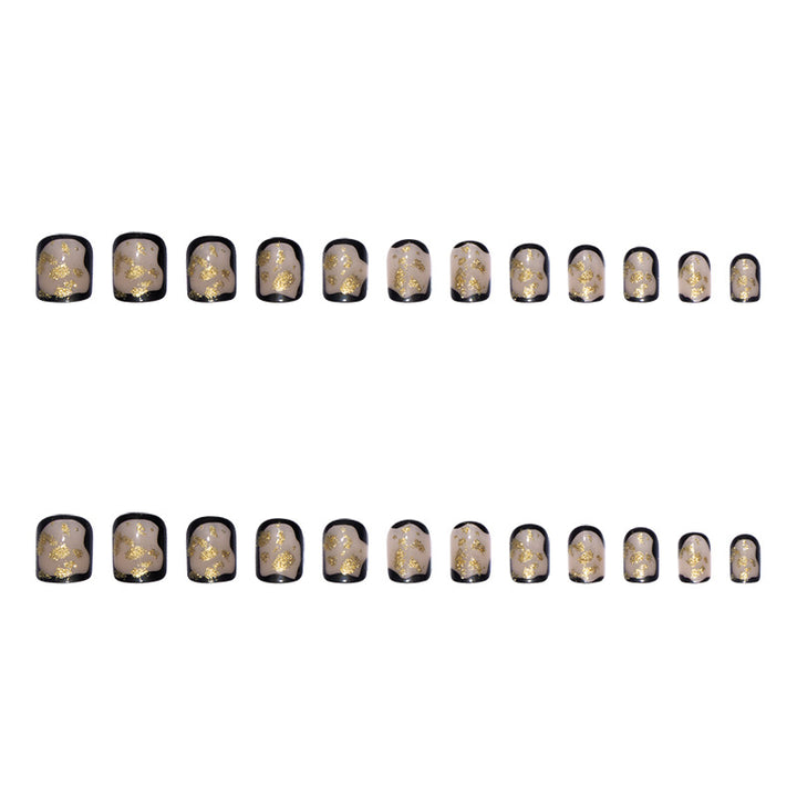 Artificial nail set with delicate gold accents and elegant finish Stornfield