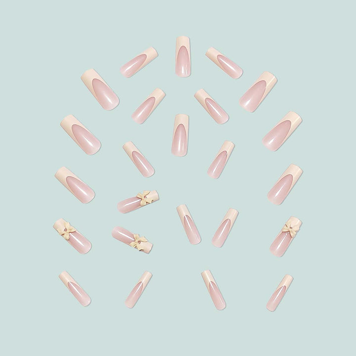 Artistic acrylic nails with bow decorations Stornfield