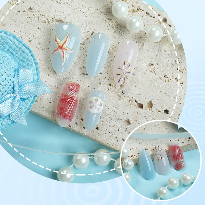 Artificial nails with maritime shell motifs Stornfield