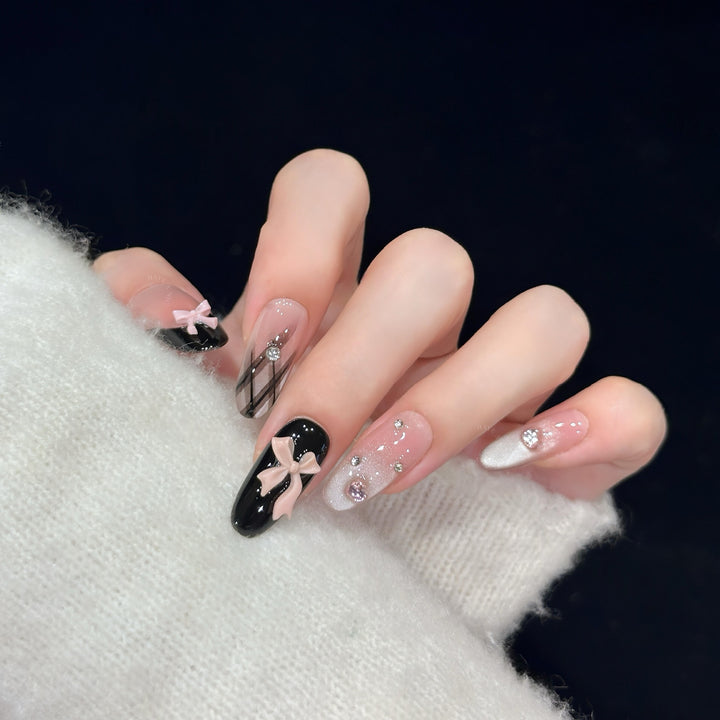 Artificial nail tips with elegant bows and glitter details Stornfield