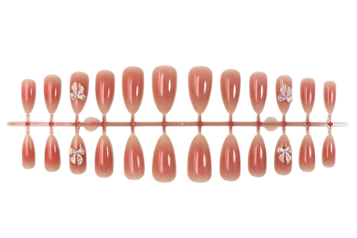 Nail set with elegant ombre effects and sparkling accents Stornfield