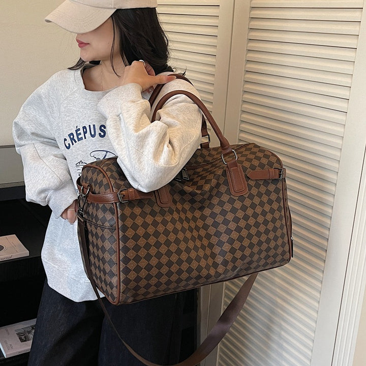 Sporty travel bag with multiple compartments and reinforced carrying handles Stornfield