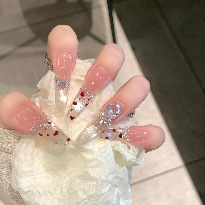 Nail art set with sparkling rhinestones and heart design Stornfield