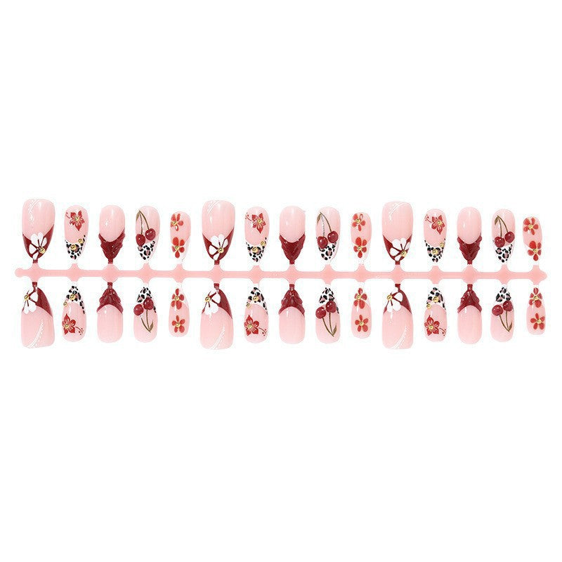 Elegant artificial nails with floral accents and glitter Stornfield
