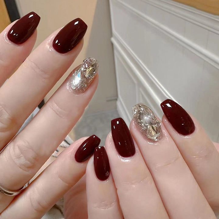 Artfully designed Gel nails with rhinestone decorations Stornfield