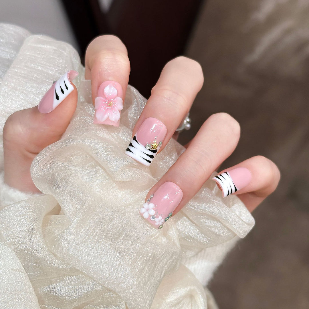 Artistic Press-On Nail Enhancements with Pattern and Gem Accents