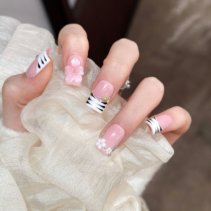 Artistic Press-On Nail Enhancements with Pattern and Gem Accents