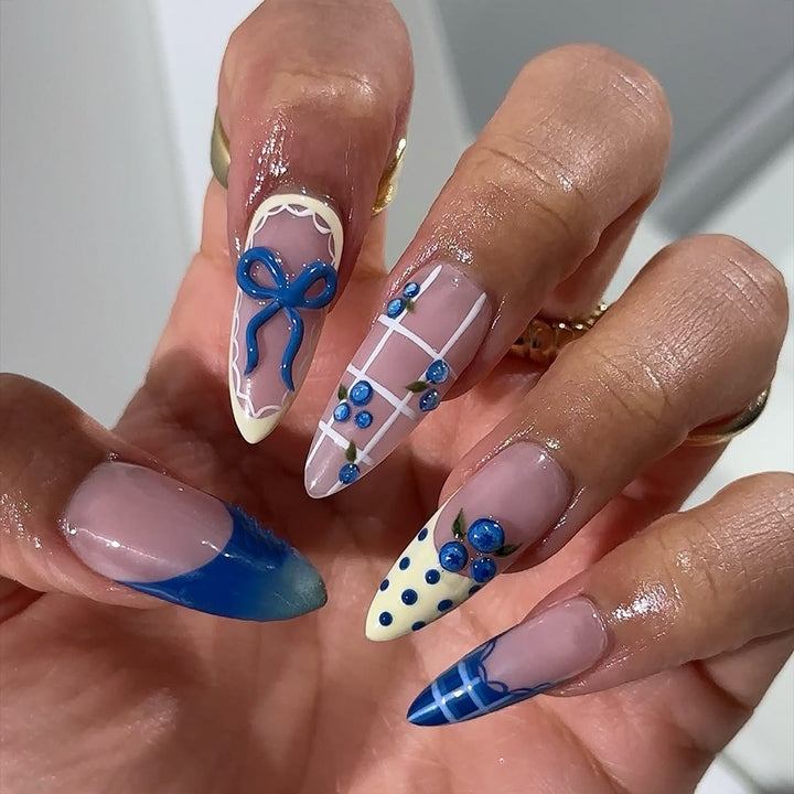 Artificial nails with playful design and elegant accents Stornfield