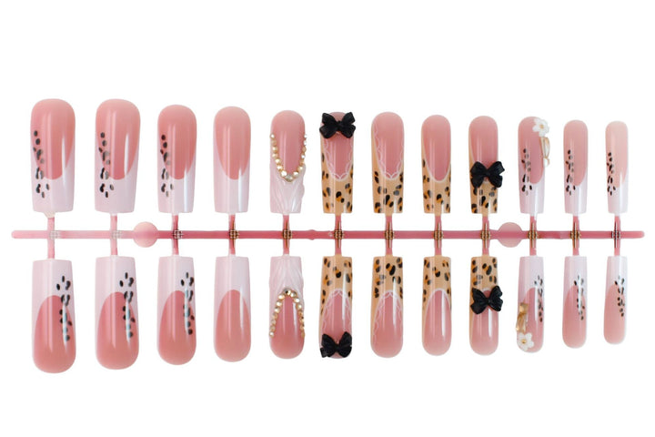 Artificial nails with elegant animal patterns and jewelry details Stornfield