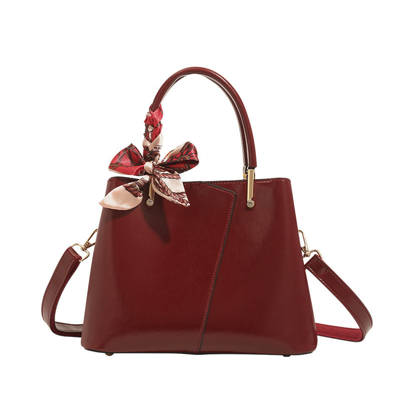 Stylish Structured Handbag with Decorative Scarf