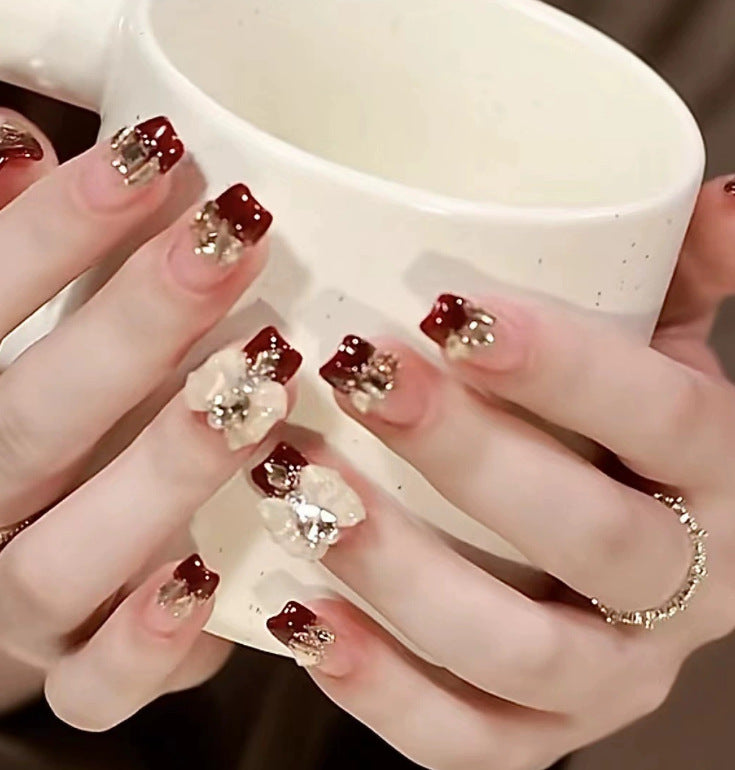 Elegant nail design with pearl embellishment Stornfield