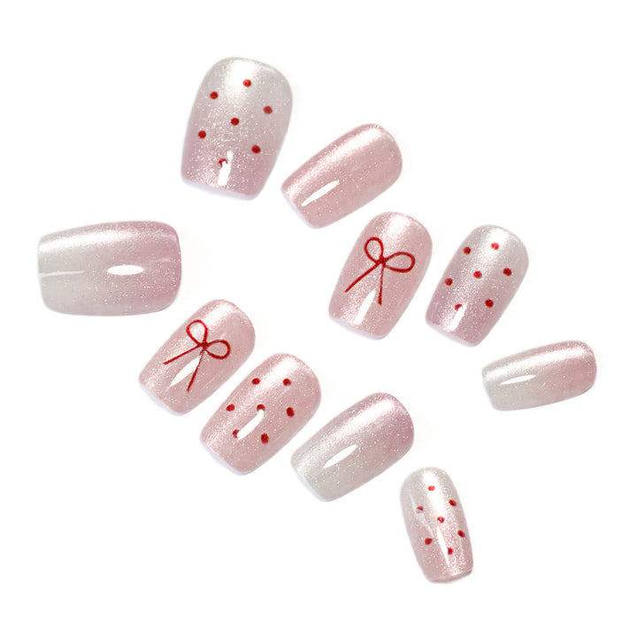 Artificial nail art with cute bow design Stornfield