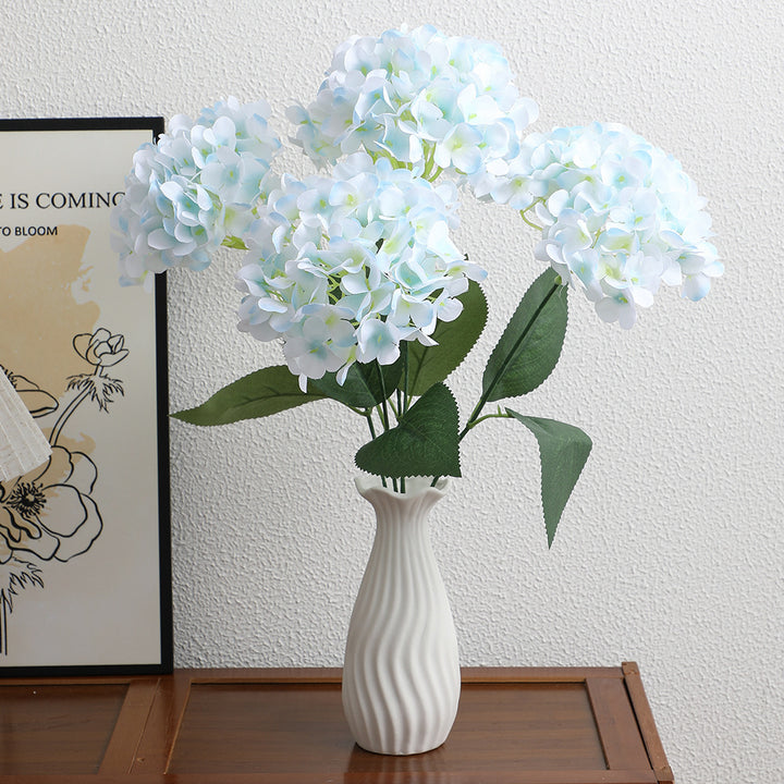 Decorative artificial flower arrangement