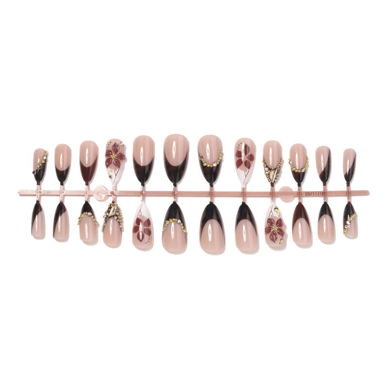 Acrylic nail set with elegant flower and glitter accent Stornfield