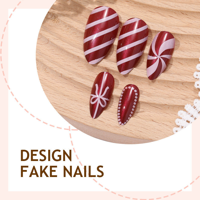 artfully designed nail set with festive candy cane motifs Stornfield