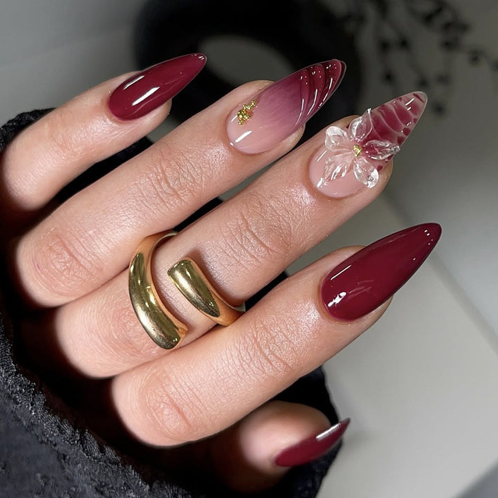 Artificial nail set with modern stiletto design and impressive flower appliqué Stornfield