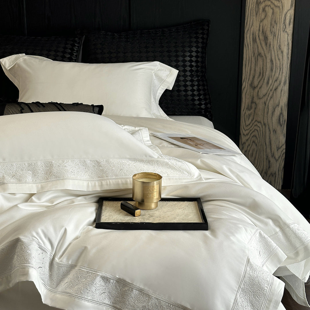 Premium cotton satin bedding set with integrated lace trim and delicate floral embroidery