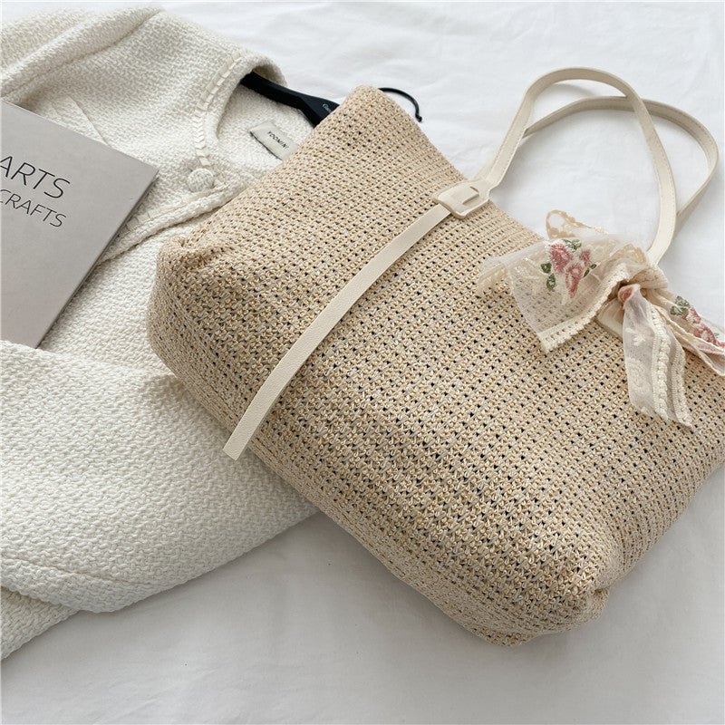 Elegant Woven Straw Tote Bag with Decorative Bow