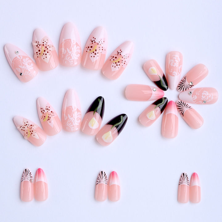 Artificial nails with creative floral designs and glitter accents Stornfield