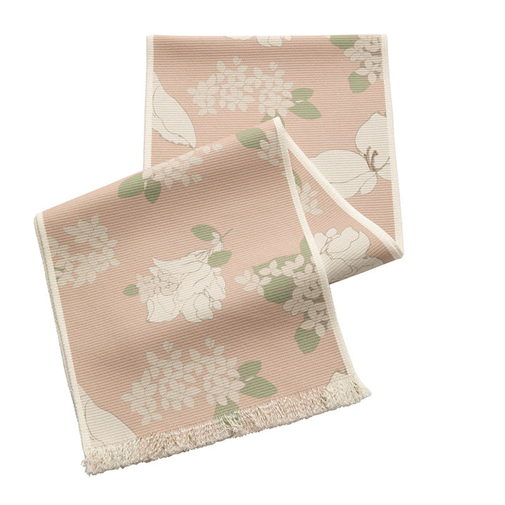 Woven table runner with floral jacquard pattern and fringed edge Stornfield
