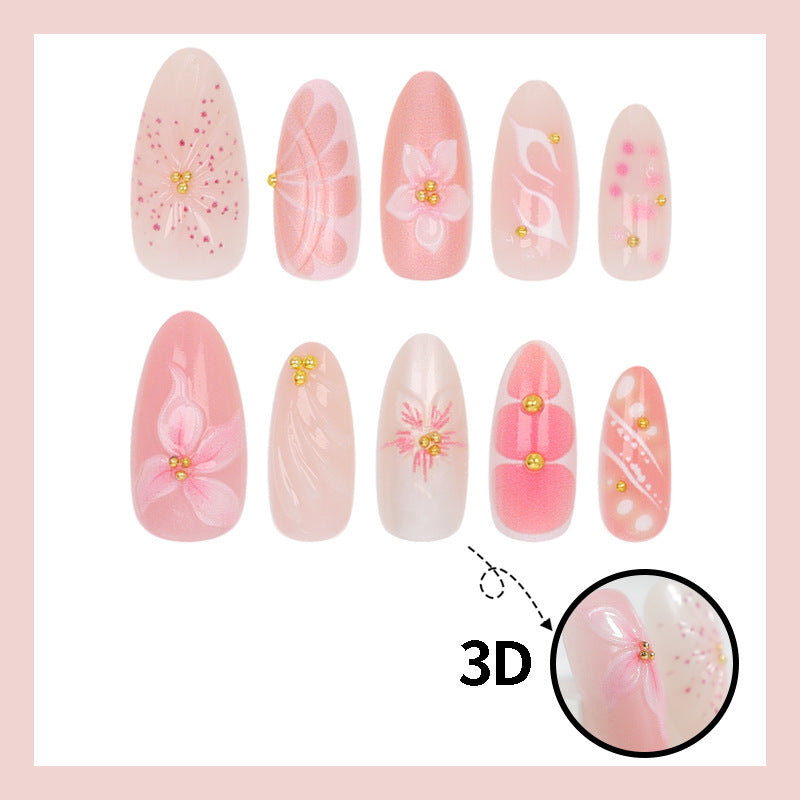 Artificial nails with floral designs and glitter accents Stornfield