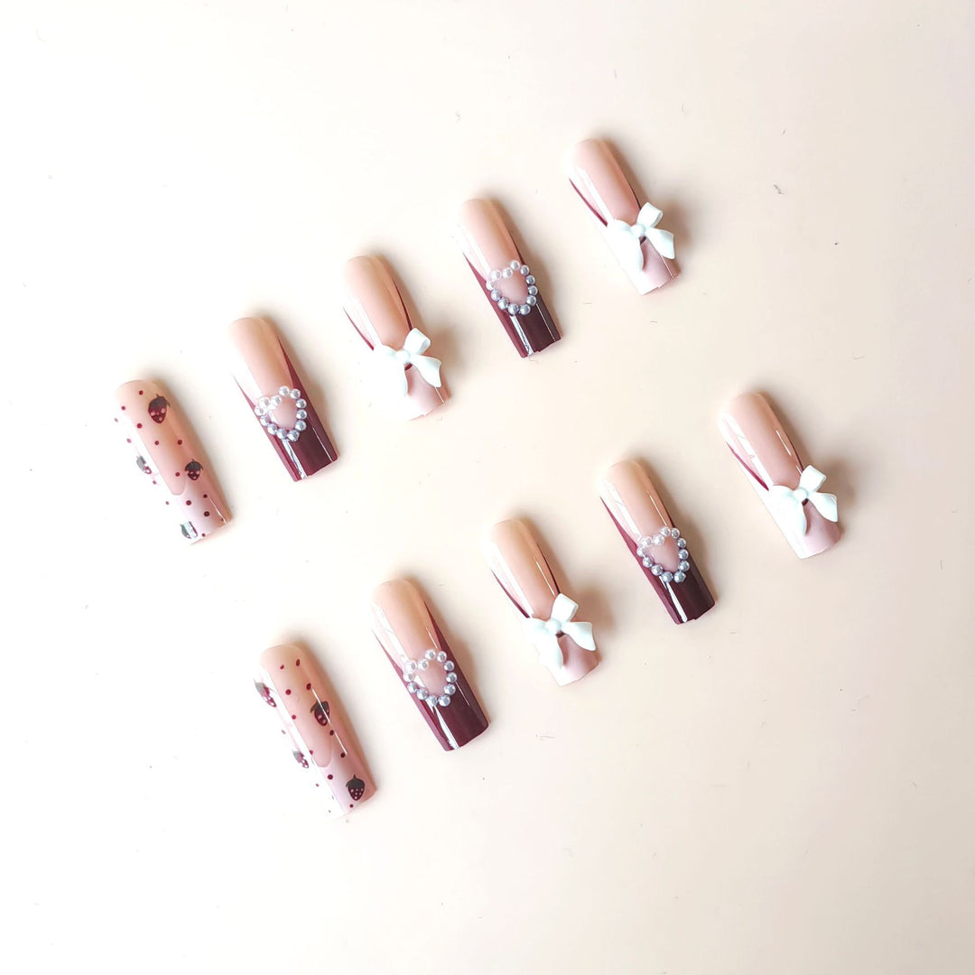 Artificial artificial nails with heart designs and holographic accents Stornfield