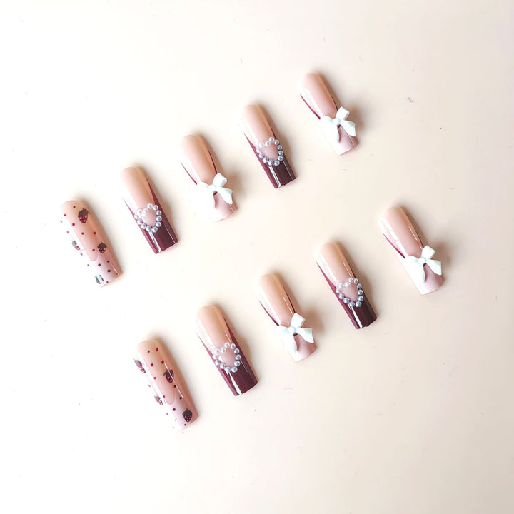 Artificial artificial nails with heart designs and holographic accents Stornfield