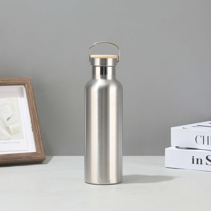Women's stainless steel insulated drinking bottle with sustainable bamboo lid Stornfield