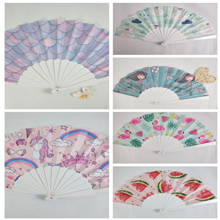 Women folding hand fan with shimmering scale pattern Stornfield