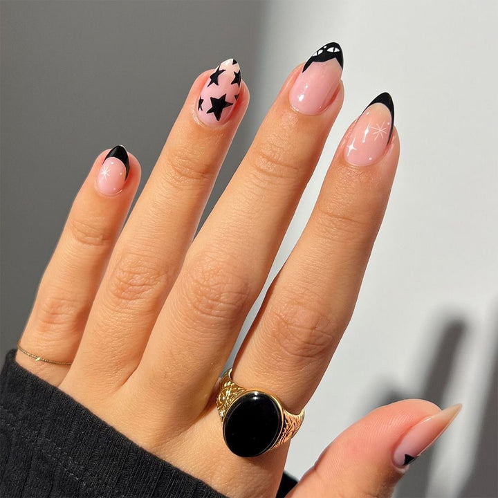 Artificial nail art with playful dots and bows Stornfield